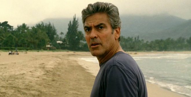 George Clooney in a scene from the Descendents George Clooney on a beach in the movie Descendents