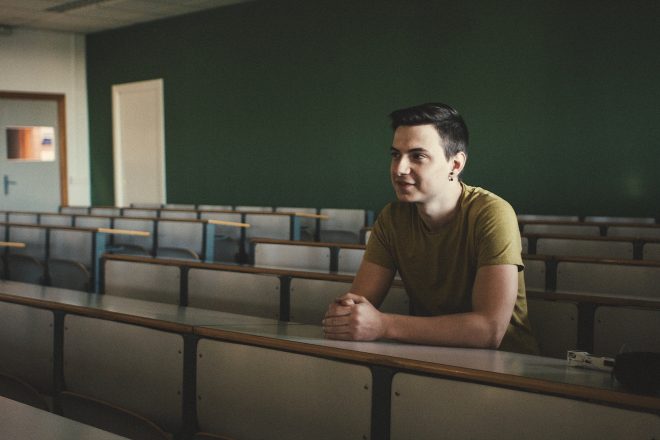 Man in a university classroom